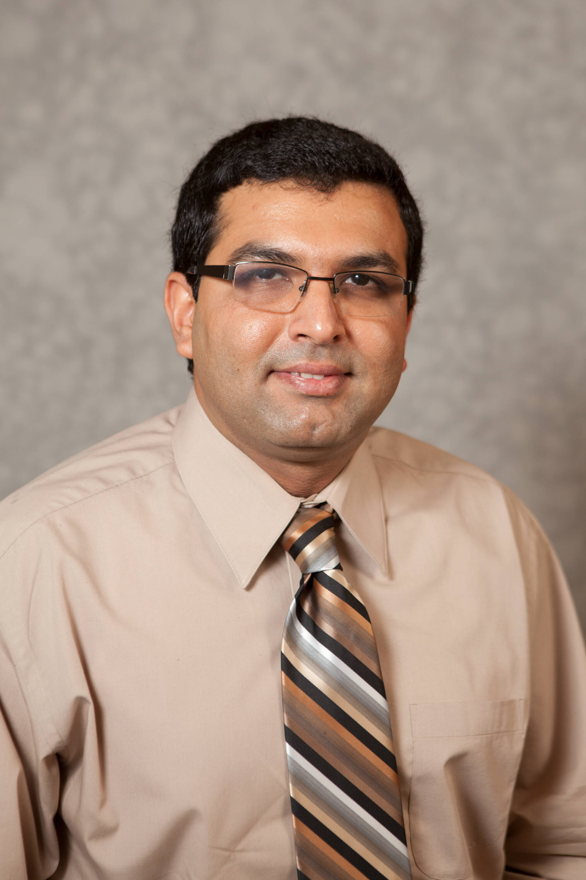 Engineering faculty and staff headshots taken on 08/25/2011 and 10/05/2001